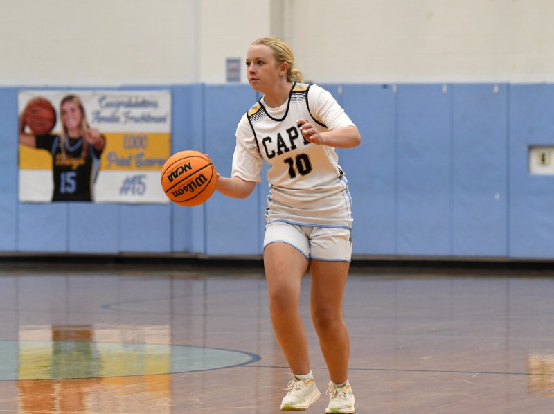 Cape junior unified partner Elizabeth Sprague brings the ball up the court.