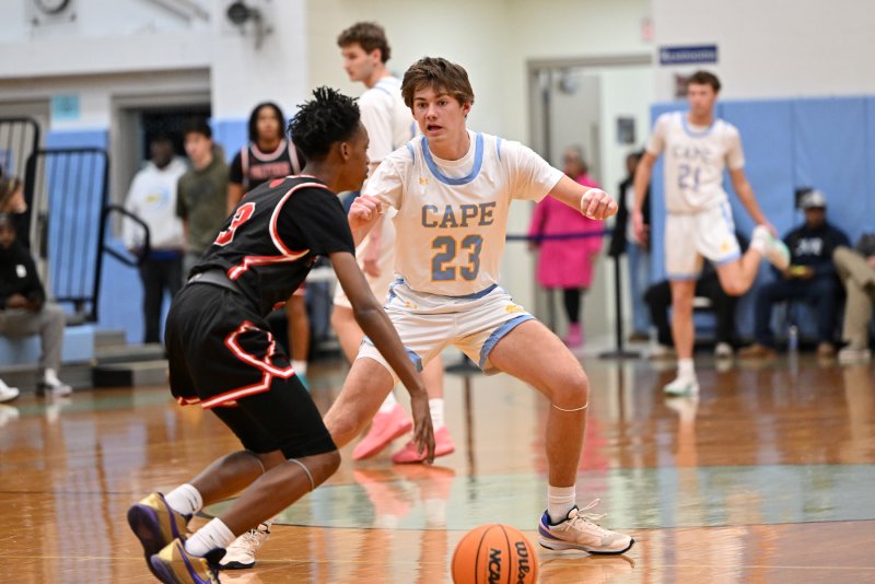 Cape senior Mikey Thompson plays tough defense on Polytech’s Riley Robinson. DAN COOK PHOTO