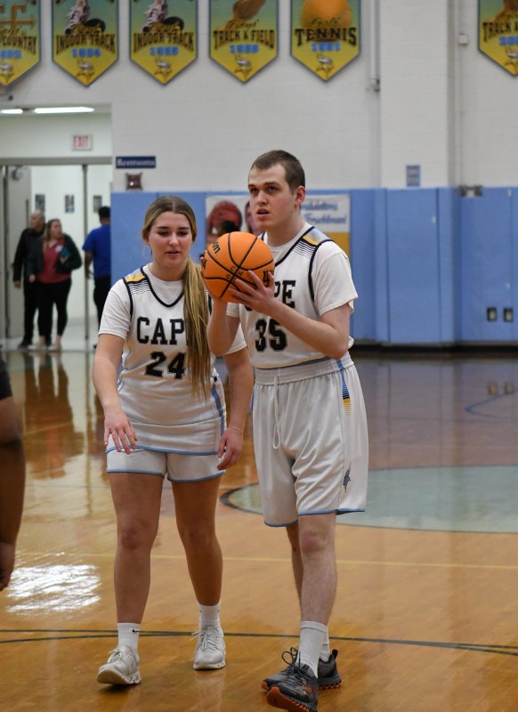 Daniel Gartman takes a shot with an assist from unified partner Brynne Fox.