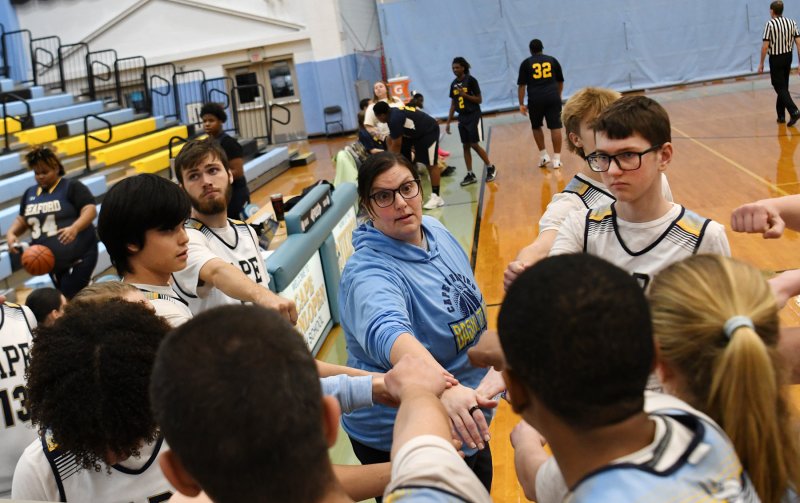 Cape head coach Katie Collick leads a cheer.