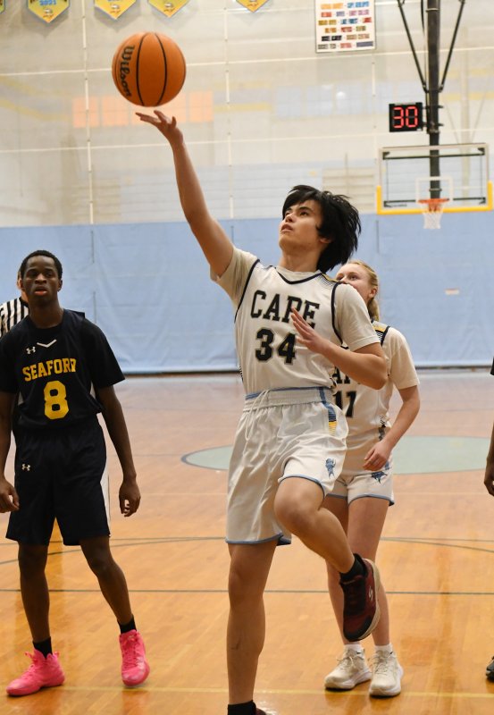 Senior Ronald LeRoy glides in for a finger roll.