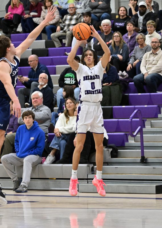 Royals senior Seth Mifflin takes a three.