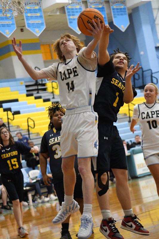 Unified partner Bennett Steinmann battles for a rebound with the Jays’ Timothy White.