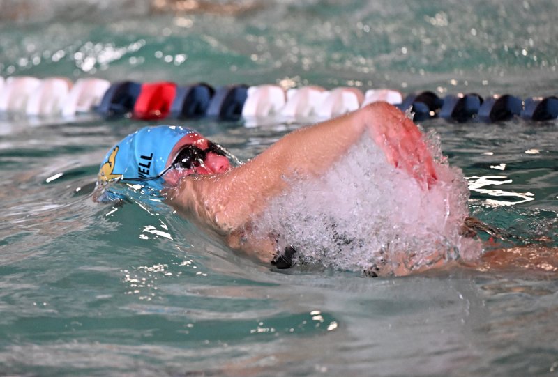 Sidney Caldwell swims the backstroke leg of the medley relay.