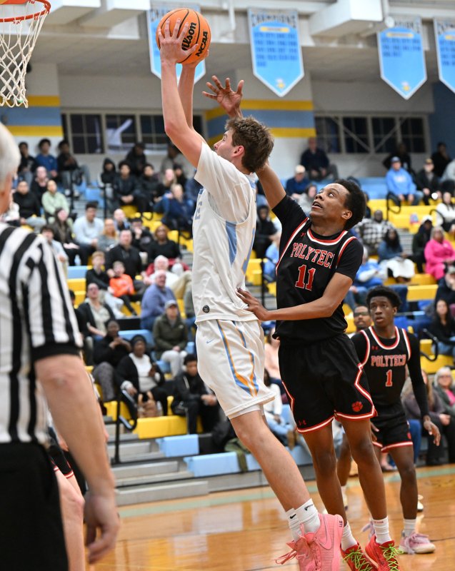 Braxton Figgs goes up and under on Polytech’s Sakhi Anderson. DAN COOK PHOTO