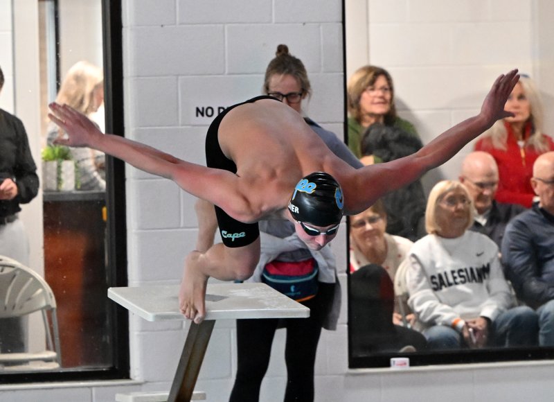 Cape junior Elijah Oliver leaves the blocks in the 100 free.