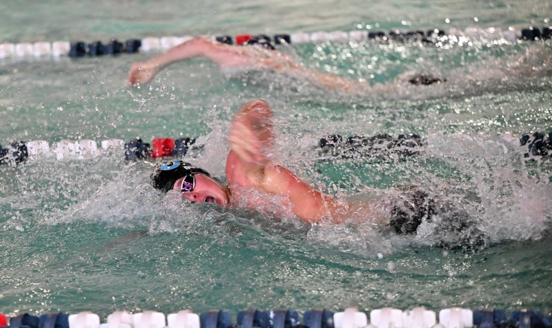 Cape junior Elijah Oliver pulls in front of his Sallies opponent in the 100 free.