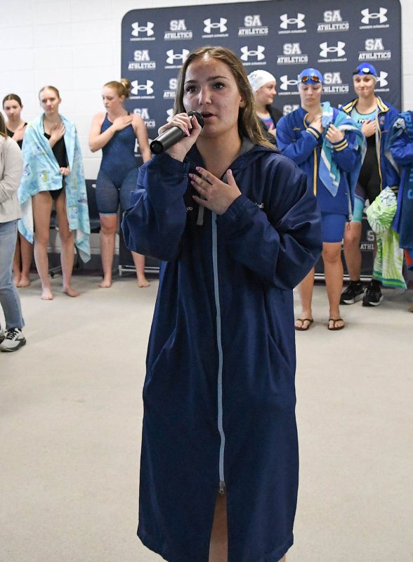 Cape senior Sidney Caldwell sings the national anthem to open the event.