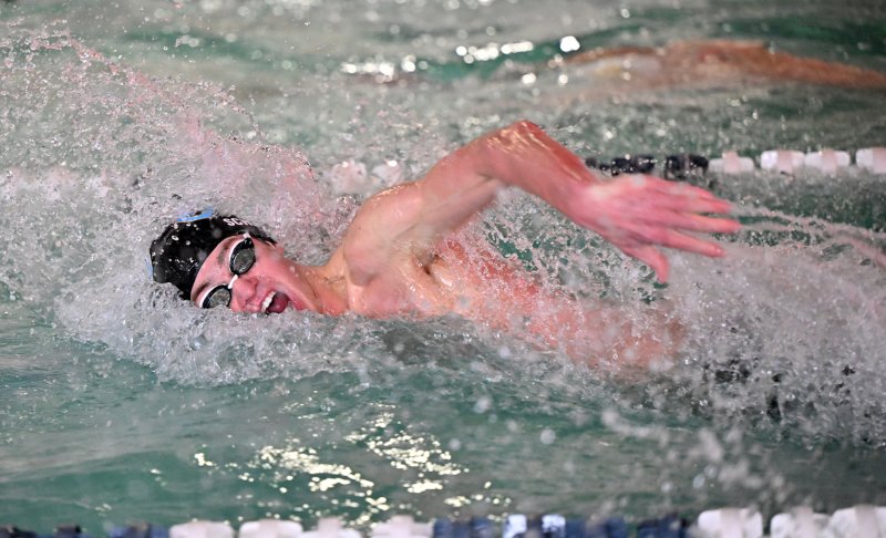 Brady Schell swims the 50 freestyle for the Vikings.