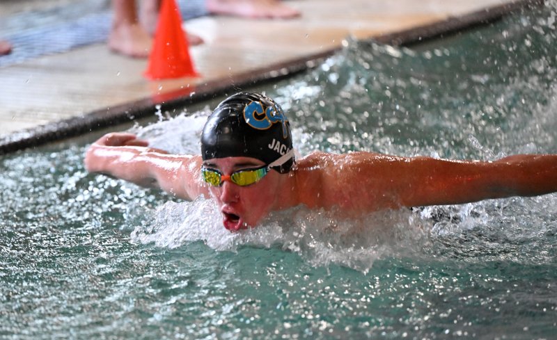 Hugh Jack swims the 100 fly for Cape.