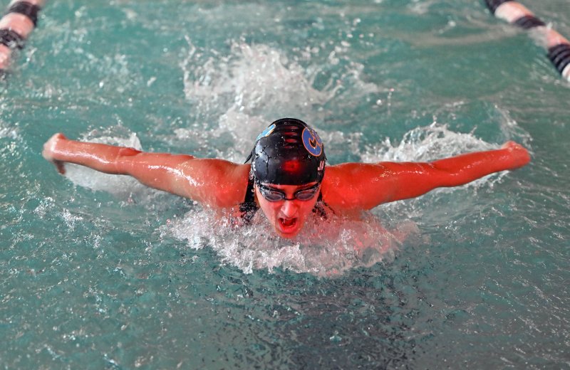 Cape junior Mia Jaoude wins the 100 butterfly in 58.76.