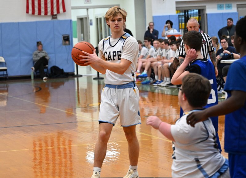Cape senior Logan Felker gets an assist to Norman Rust.