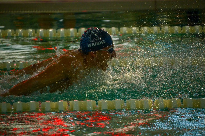 Sussex Academy senior Christian Wright showcases his versatility by winning the butterfly.