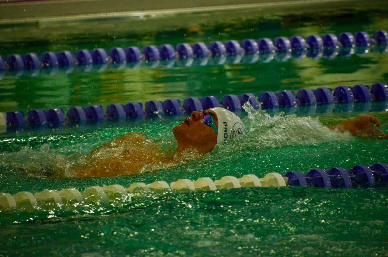Sussex Academy senior Kieran Probert competes in the backstroke.