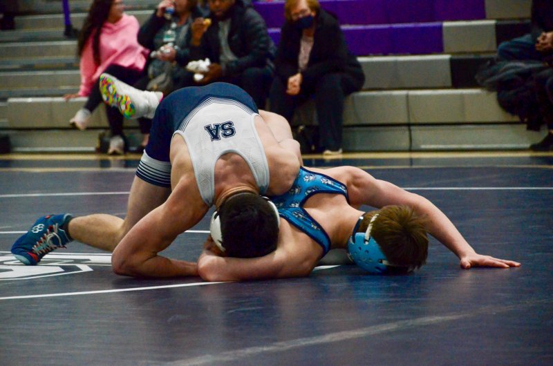 Seahawks senior Ryan Buckler gets some deodorant on his hair while working Jacob Jackson’s shoulder.