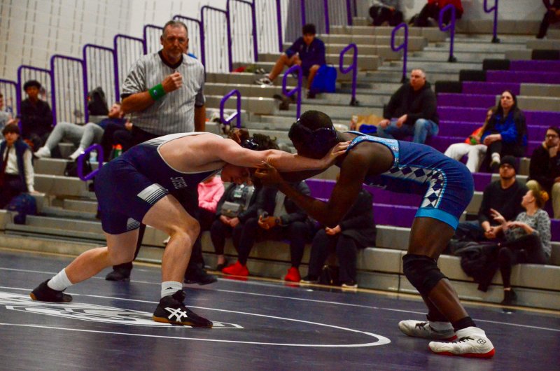 Seahawks freshman Charlie Bowman does the best he can against Lake Forest senior Jerusalem Howard, one of the best in the 157-pound weight class in Delaware.