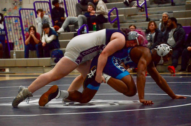 Sussex Academy senior Talah Patton throws everything but the kitchen sink at Walter Bond to try and make up some ground.