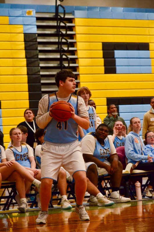 Vikings sophomore Michael Anthony looks for an open teammate.