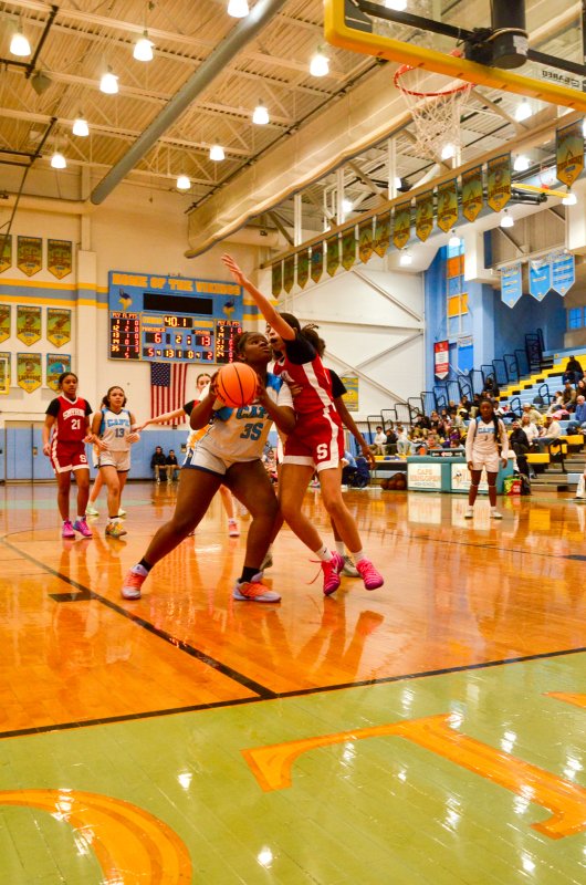 Mariner sixth-grader Kaimara Toppin absorbs some contact.