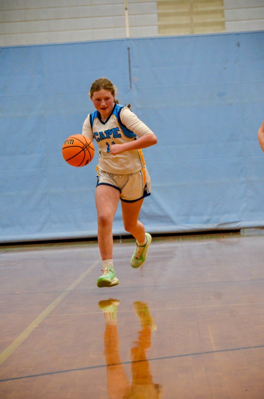 Mariner eighth-grader Mackenzie Bean brings the ball up.