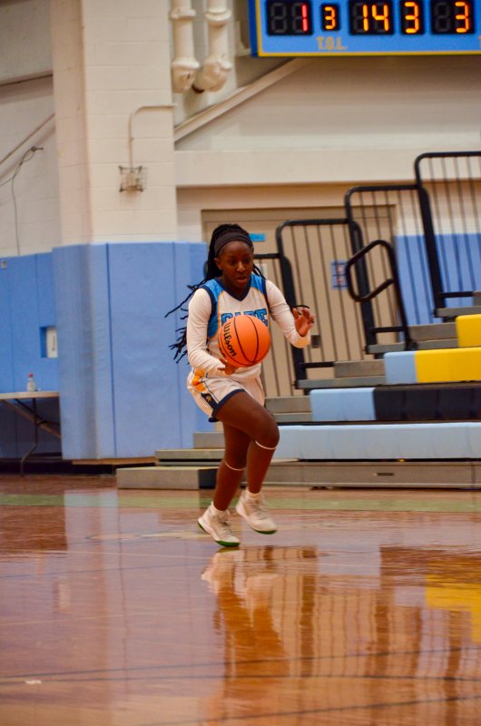 Mariner seventh-grader Melody Sivels begins to cross mid-court.