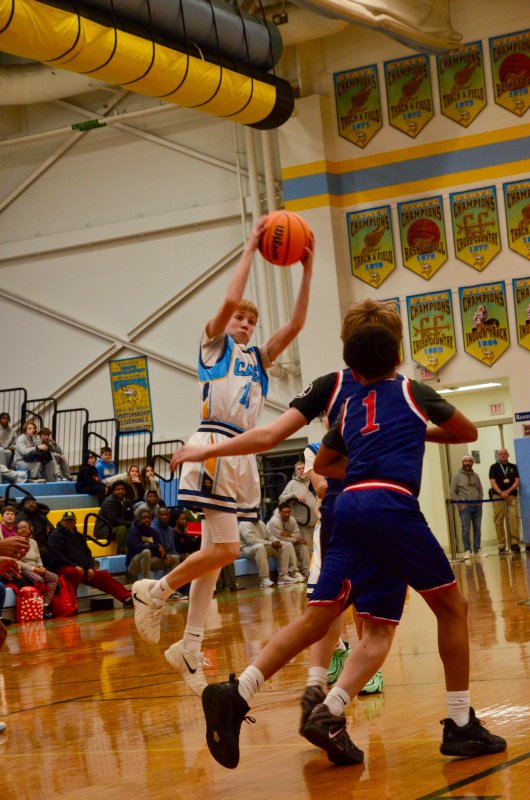 Mariner eighth-grader Liam Tyndall reaches up for a steal.
