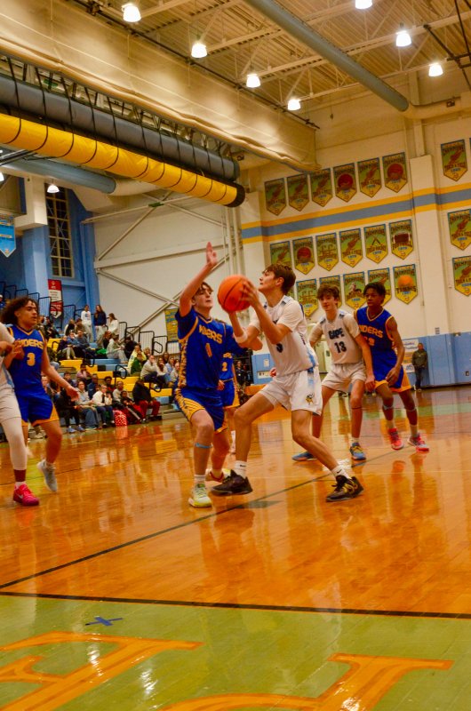 Fred Thomas eighth-grader Robbie Myers tries to get clear for a shot.