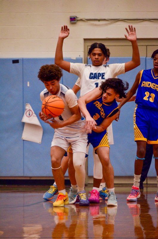 Fred Thomas eighth-grader Cam Thomas fights for a rebound.