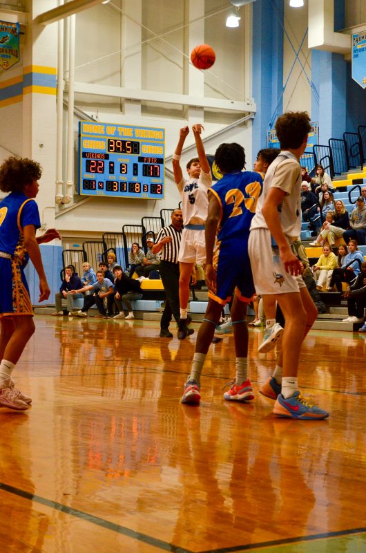 Fred Thomas eighth-grader Robbie Myers shoots from distance.