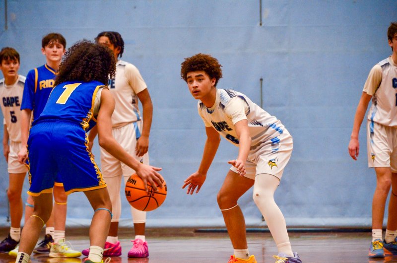 Fred Thomas eighth-grader Cameron Bell forces his guy left.