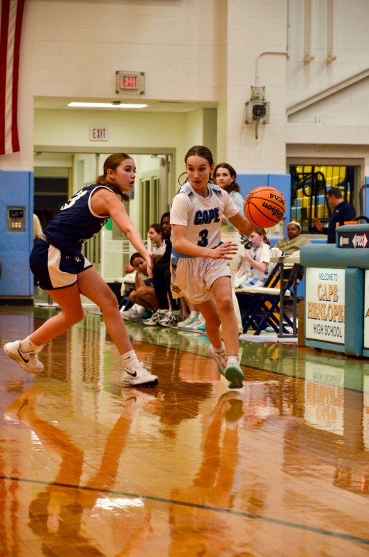 Fred Thomas eighth-grader Sophia Connelly runs by the press box.