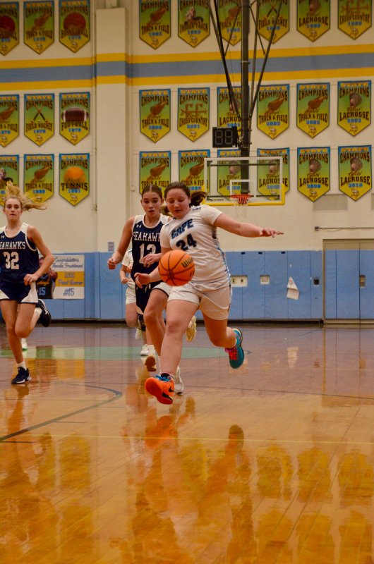 Fred Thomas seventh-grader Cali Smith runs to catch up to a loose ball.