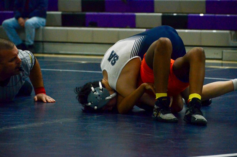 Sussex Academy freshman Ryan Pena picks up a pin to start the Delmar match Jan. 30.