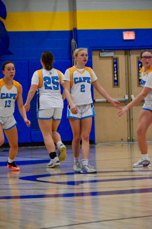 Beacon eighth-grader Kelly Neustadter gets props after sinking a three.