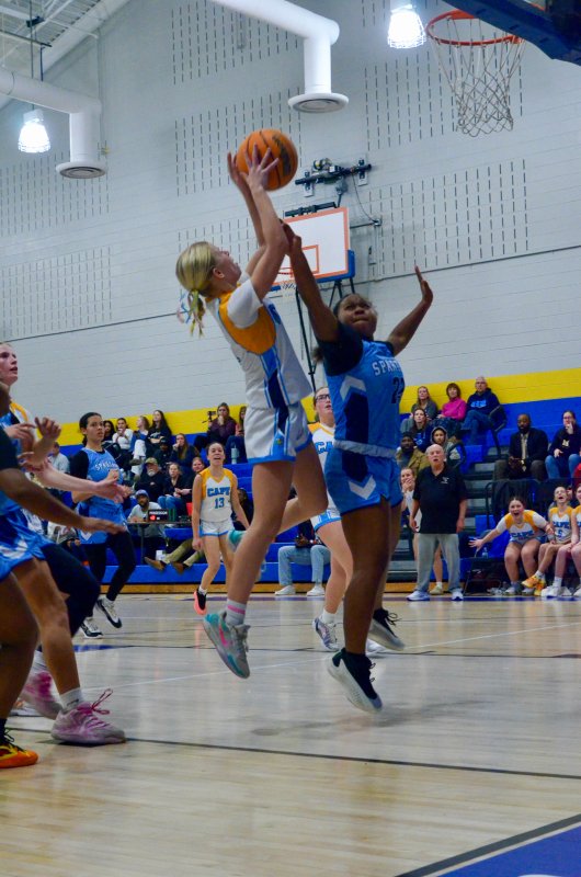 Beacon eighth-grader Kelly Neustadter makes a difficult lay-up.