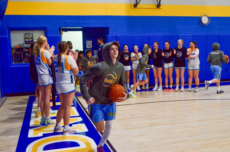 The Beacon girls support the Beacon boys after the former continued its undefeated season and before the latter picked up its first win.