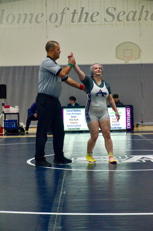 Sussex Academy senior Talah Patton gets her hand raised for a forfeit.