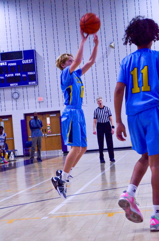 Beacon sixth-grader Lincoln Wilson gets a shot off.
