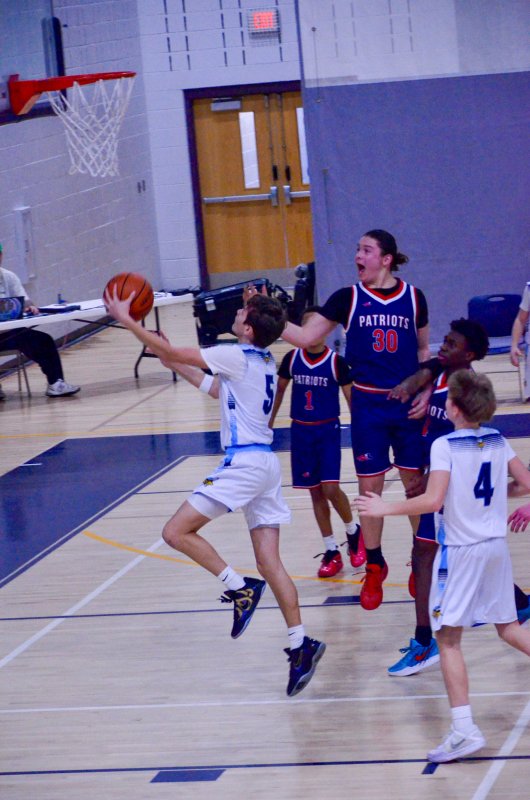 Fred Thomas eighth-grader Robbie Myers lays one in.