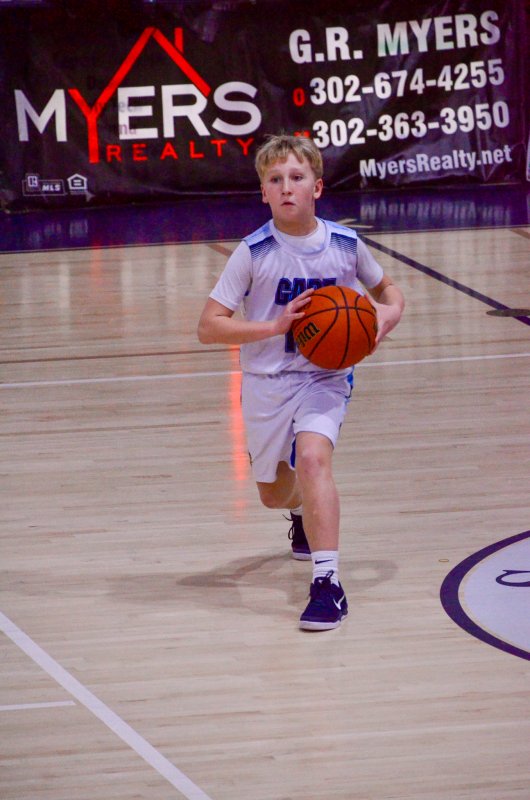 Fred Thomas sixth-grader Ben Peace keeps the potato hot.