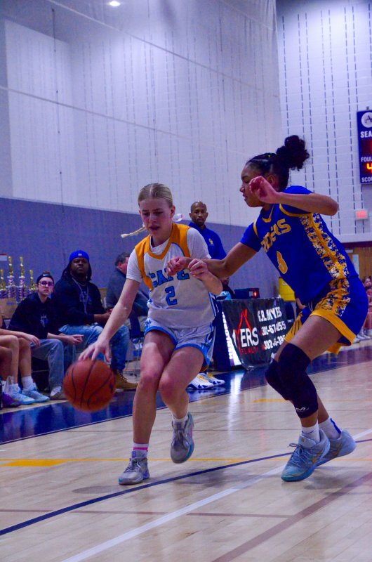 Vikings eighth-grader Kelly Neustadter protects the ball.