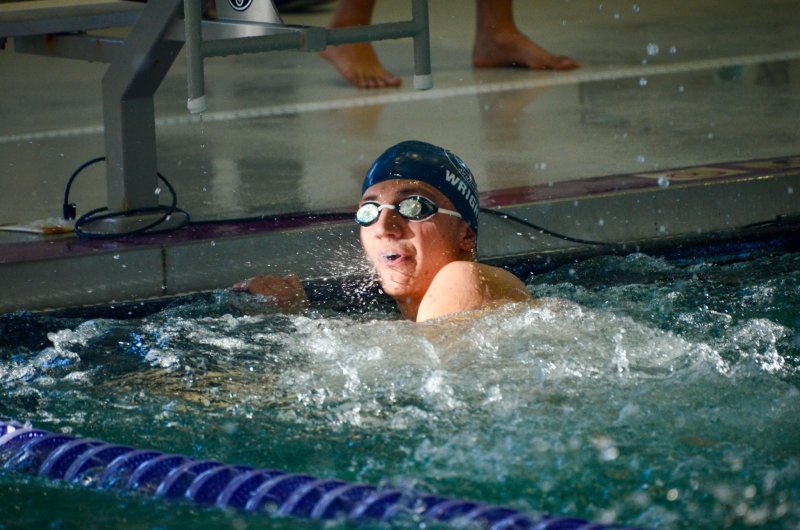 Seahawks senior Christian Wright checks out his winning time in the 50.