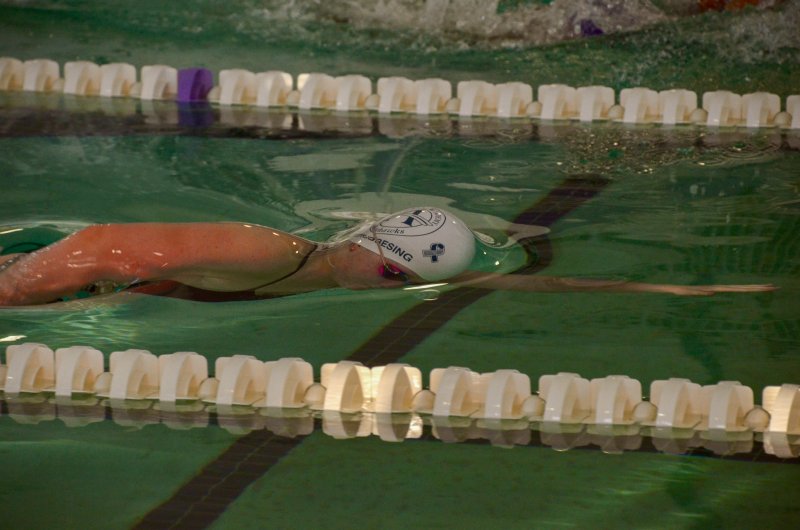 Seahawks senior Emily Obertubbesing swims under the top skin of water.