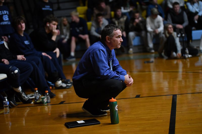 Coach Chris Mattioni watches the match unfold.