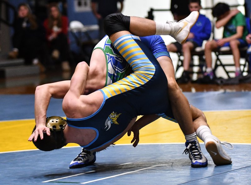 Tripp Gannon hangs onto Randy Cordel.