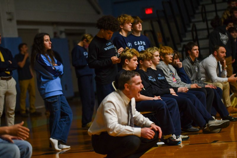 Coach Chris Mattioni is known for his calm demeanor during matches.