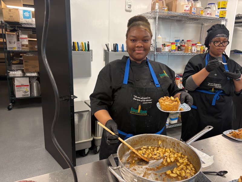 Jasmine Simms shows off her apple scrapple crumble pie as part of mid-terms for culinary students at the Food Bank of Delaware in Milford. The students were asked to create their own dish that would then be tasted and voted on by a judges panel. RYAN MAVITY PHOTOS
