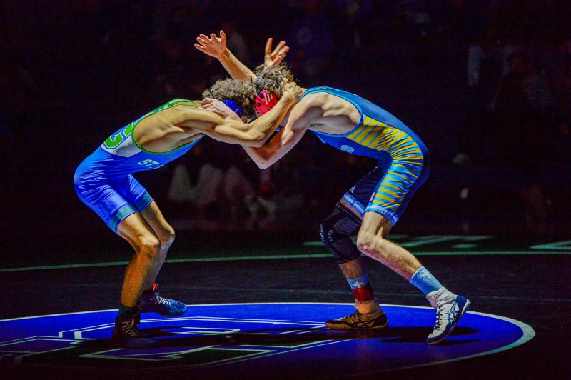 All hands team. Austin Guerrieri, right, battles Maddox Stanley.