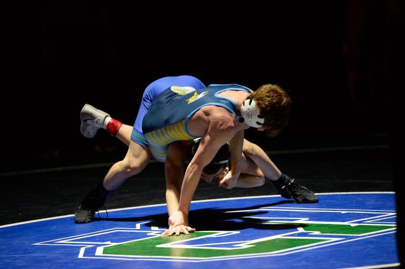 Cape freshman Andrew Egolf battles Cameron Mendick, losing 10-5.