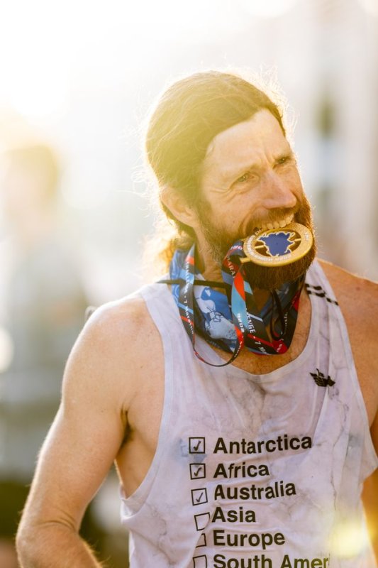 Local ultra-marathoner Mike Wardian celebrates winning the World Marathon Challenge for the third time.